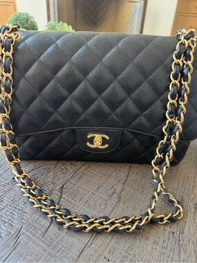 CHANEL Microchipped Jumbo Black Quilted Caviar Leather with Gold Hardware